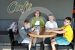 Mother with sons waiting food