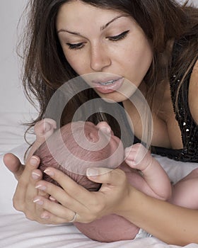 Mother soothing baby photo