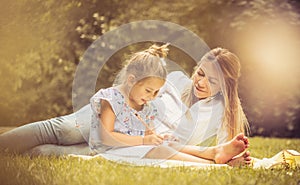 Mother spending time with daughter at nature. Family time.