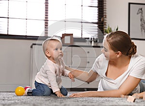 Mother spending time with her baby at home