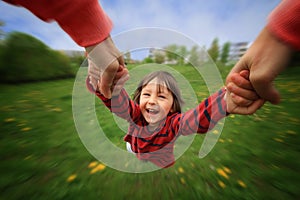 Mother, spinning in circle her little baby boy, pure joy, radial