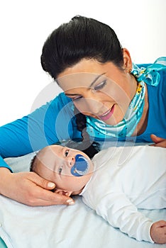 Mother talking with her newborn baby
