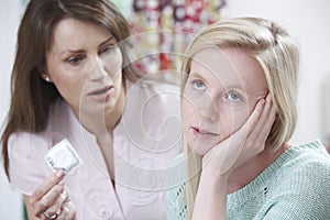 Mother Talking To Teenage Daughter About Contraception