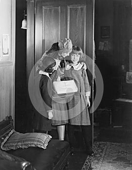 Mother talking to two daughters