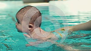 Mother teach baby to swim