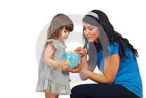 Mother teach daughter about world globe