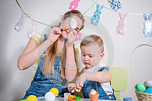 Mother teaches kid to do craft items