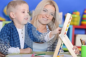 Mother teaches son to count