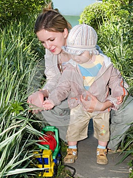 Mother teaching botany her kid