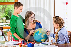 Mother teaching kids private lessons for school