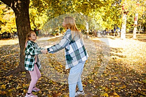 Mother and teen daughter quarreling in park. Mother criticizing her disobedient child for bad behavior. Children upbringing