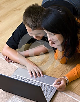 Mother and teenage boy with laptop