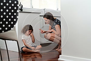 Mother telling off and discipline naughty daughter