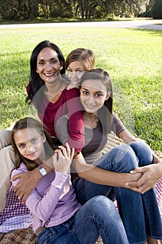 Mother and three children in park