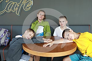 Mother with three sons waiting food