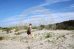 Mother and toddler on beach