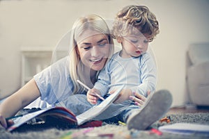 Mother and toddler boy spending time together.