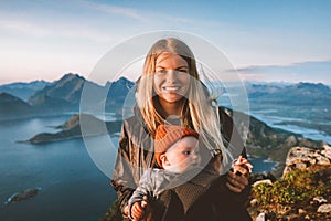 Mother traveling with baby healthy lifestyle outdoor family travel in Norway summer vacations happy smiling