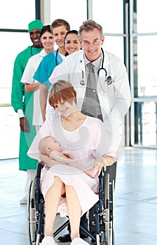 Mother in a weelchair with her newborn baby