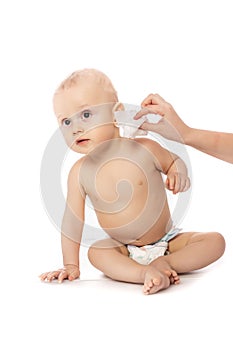 Mother Wiping Baby`s Face isolated on a white background. concept cleaning wipe, pure, clean