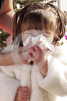 Mother Wiping Sick Toddlers Nose