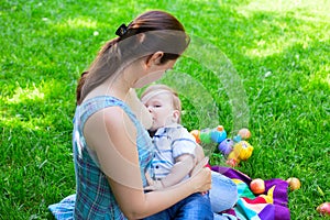 Mother woman breastfeeding baby boy kid