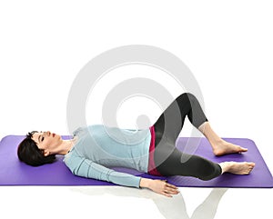 Mother woman exercising doing postnatal workout. Female fitness instructor stretching hands and legs in gym and work out exercises