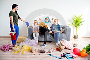 Mother yelling on her romping kids photo