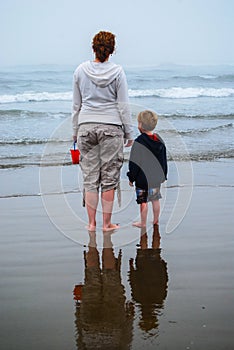 Mother and Young Child watching waves