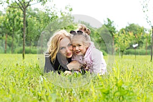 Mother and young daughter in countryside