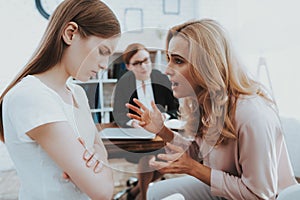 Mother and Young Daughter in Psychologist Office.