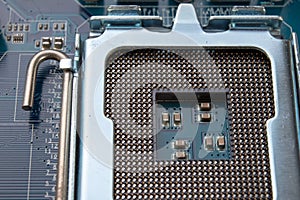 The motherboard and computer components. Computer accessories on a workshop table