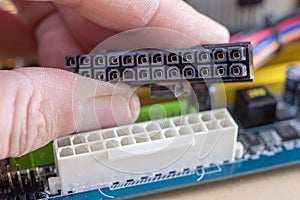 The motherboard and computer components. Computer accessories on a workshop table