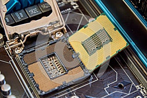 the motherboard processor is removed from above close up CPU closeup