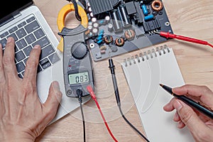 Motherboard repair close-up, electronic hardware concept