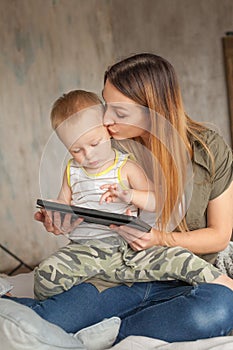 Motherhood and Education concept. Happy mother with child boy