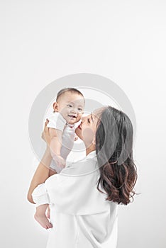 Motherhood and lifestyle concept. Smiling young mother with little baby at home