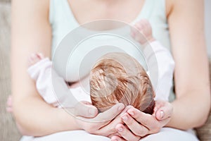 Motherhood. newborn baby on mother hands