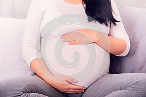 Motherhood, Pregnant woman exposing her belly.