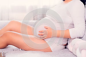 Motherhood, Pregnant woman exposing her belly.