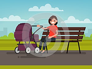 Motherhood. Young mother sitting on a bench with a pram in the p