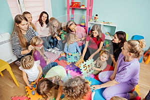 Mothers with children of different ages gathered together