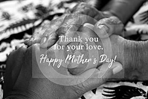 Mothers day card concept with text message - Thank you for your love. Happy Mothers Day. On background of holding hands.