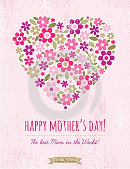 Mothers Day card with heart of flowers on pink background