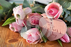Mothers day card with pink flowers and heart photo