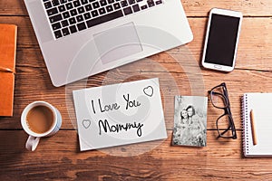 Mothers day composition. Black-and-white photo. Office desk. Woo