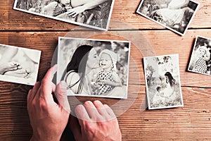 Mothers day composition. Black-and-white pictures, wooden background.