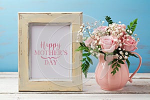 Mothers day greeting card with pink rose flower bouquet and photo frame