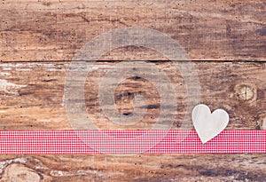 Mothers day hearts decoration on red ribbon borderand rustic wood background