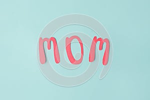 Mothers day message on paper cut hearts over blue background, simple diy creative idea, banner, greeting card for mom